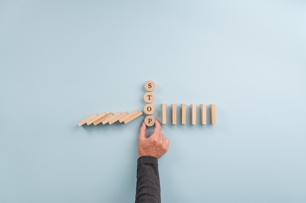 Male,Hand,Assembling,A,Stack,Of,Wooden,Cut,Circles,With