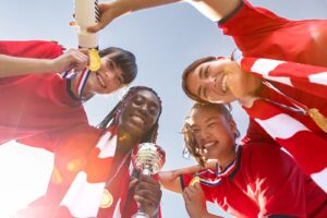 team celebrating win silver cup